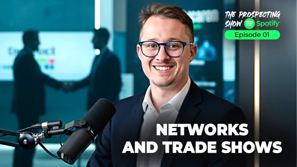 Business professionals networking at a trade show booth